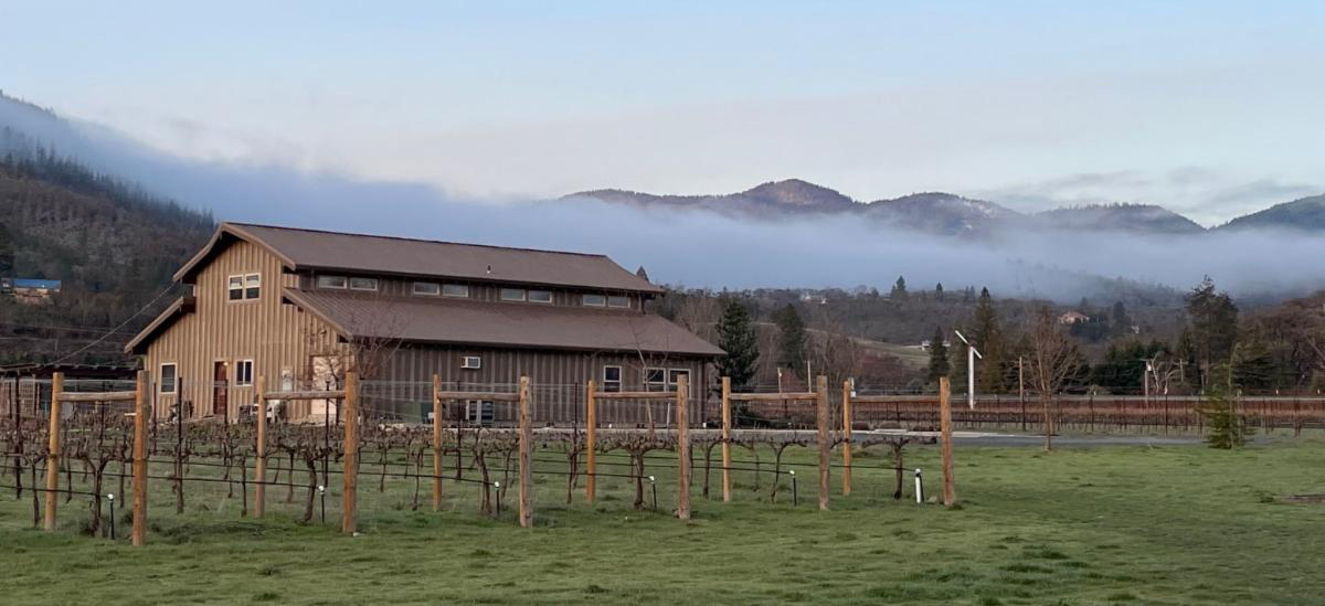 Pebblestone Tasting barn with fog in the hills