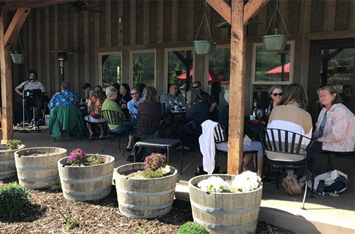 Pebblestone's porch is a great place for music and wine